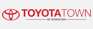Toyota Town of Stockton logo with a red Toyota emblem on the left and the words TOYOTA TOWN OF STOCKTON in red and black text on a light background.